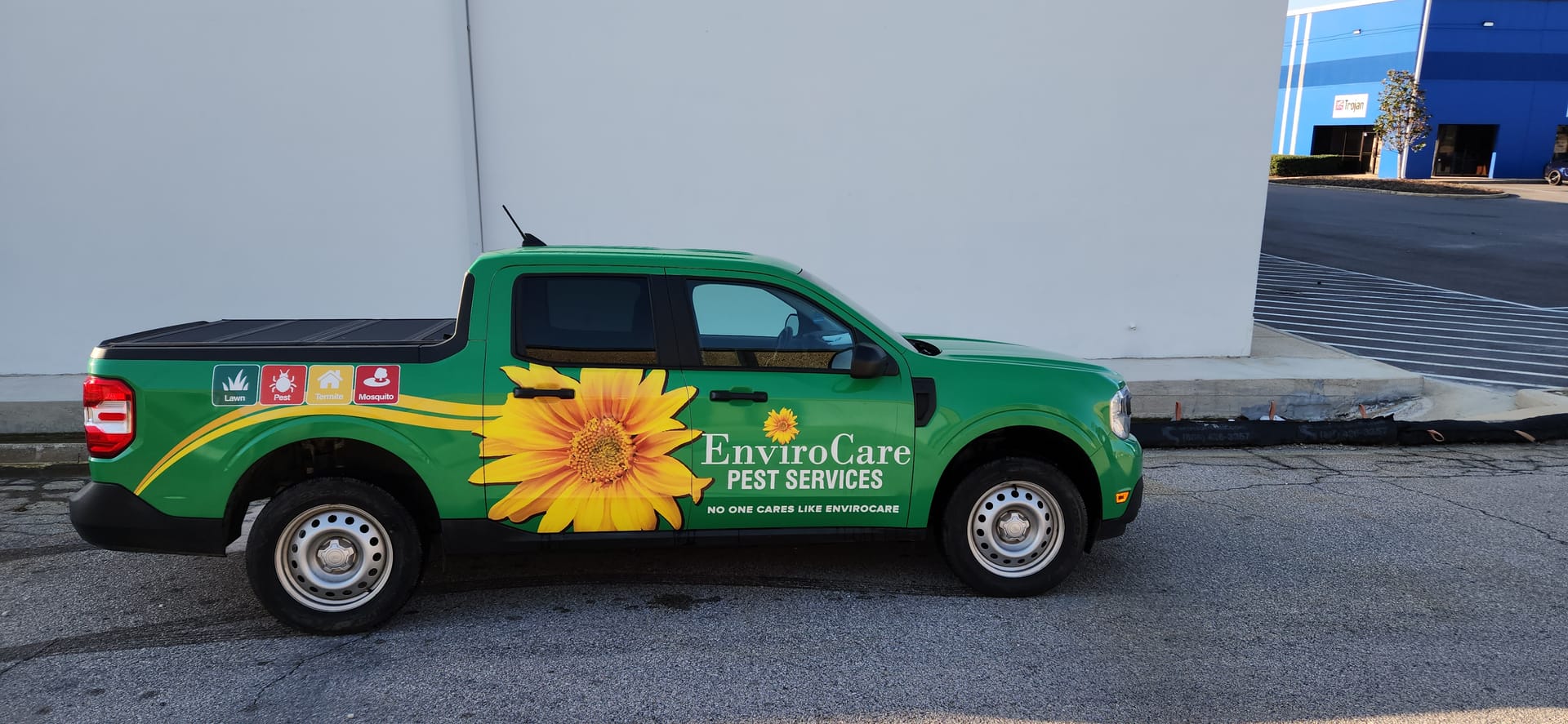 EnviroCare green service truck with sunflower wrap